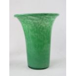 A mottled green glass vase.