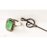 A silver, jade and marcasite ring, and a sterling silver hat pin in the form of a double clef.