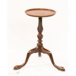 A mahogany George III kettle stand, with carved twist base.