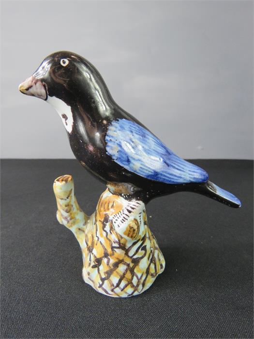 An early style glazed pottery bird.