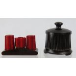 A Bakelite cruet and dispenser.