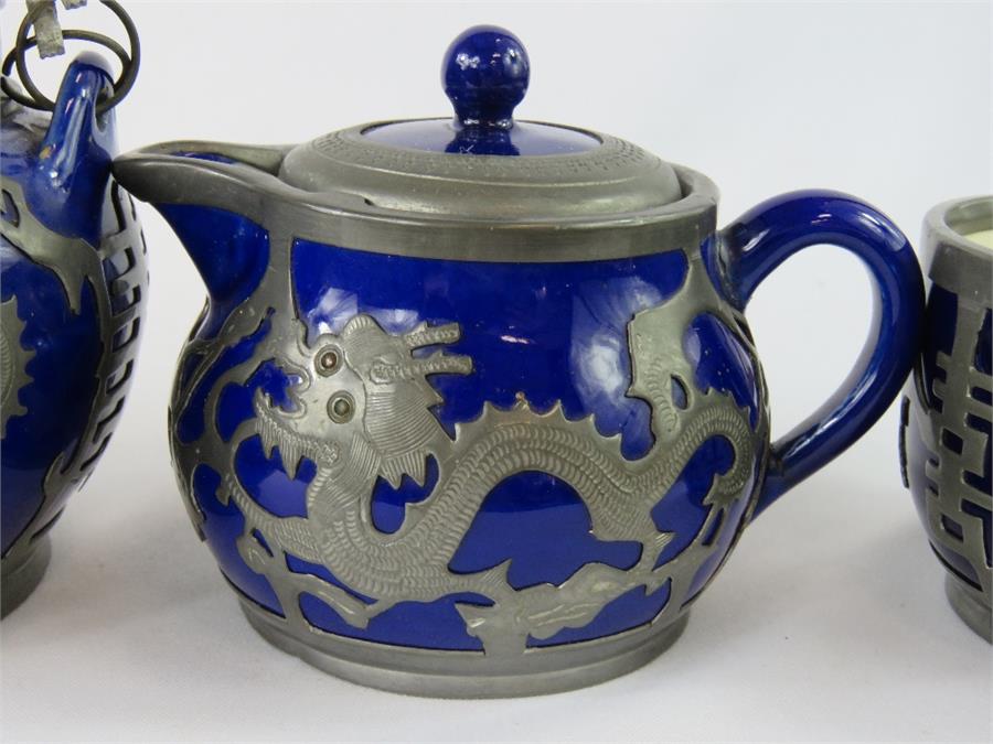 A Chinese ceramic and pewter tea set, circa 1920s, comprising teapot, hot water pot, cream and sugar - Image 3 of 3