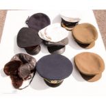 A group of assorted military hats.