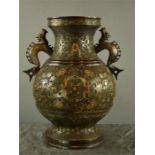 A large bronzed cloisonne Chinese vase, with dragon form handle, 54cm high.