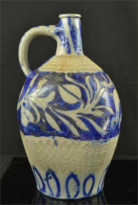 A stoneware blue glazed Westerwald type jug, of baluster square form, incised with animals, 28cm