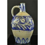 A stoneware blue glazed Westerwald type jug, of baluster square form, incised with animals, 28cm