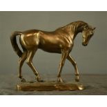 A bronzed model horse.