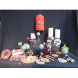 A group of Christmas decorations, old paper lanterns, wooden globes, birds, candles etc.