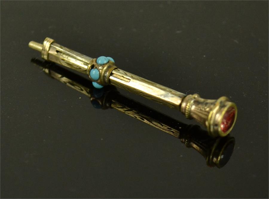 A gold 19th century pencil.