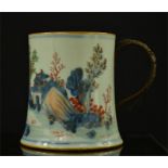 A Chinese tankard with wicker handle, depicting landscapes.