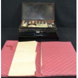 An early 20th century artists palette and a paper and envelope set.