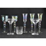 Two Waterford Crystal cocktail glasses together with a set of five iridescent wine glasses.