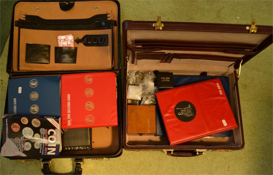 Two briefcases containing coins, including English and worldwide, coin year book and other coins.