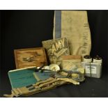 A selection of RAF collectables, to include Pilots flying log book, Flying Goggles, silk escape map,