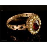 A 9ct gold, ruby and seed pearl ring.