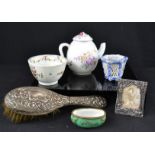 A silvered frame, hairbrush, tea pot, bowl, silvered frame etc.