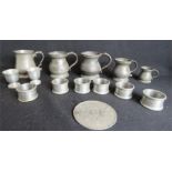 A group of pewter to include tankards, coaster, egg cups and a set of six napkin rings.