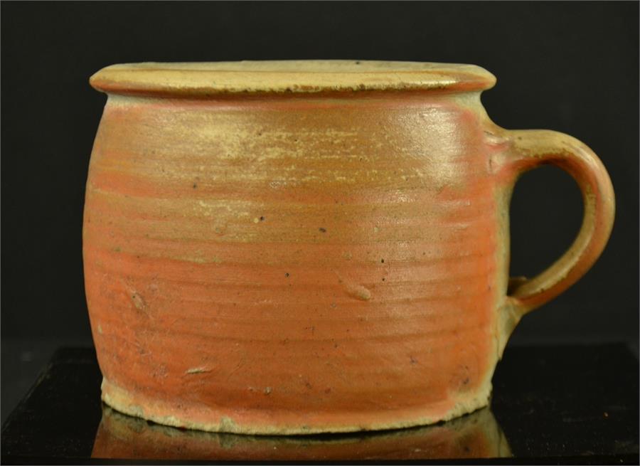 A large early stoneware porridge/gruel pot, with single handle, 12½cm high.