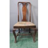 A walnut Queen Anne chair, with tapestry stop in seats, cabriole legs and H stretcher, 106cm high.