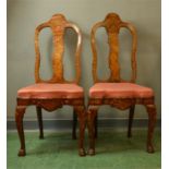 A pair of Dutch marquetry chairs, inlaid with birds and flowers, with shaped drop in silk