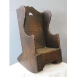 An 18th century oak child's rocking chair, 54 by 36 by 35cm.