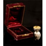 A silver egg cup, in a red velvet lined presentation case.