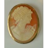 A cameo brooch in an unmarked gold setting.