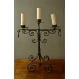 A wrought iron candleabra.