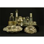 A group of silver items to include pierced dishes, dressing table glass jars, bangle etc.