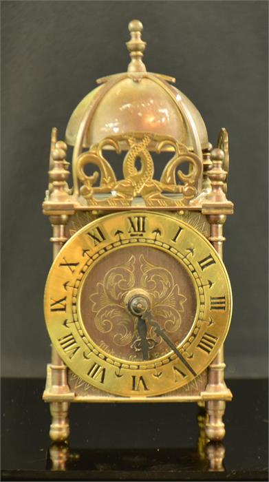 A miniature 17th century style bracket clock.