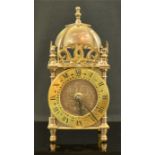 A miniature 17th century style bracket clock.