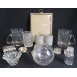 A silver metal photograph frame, glass bauble, pair of glass etched tankards etc.