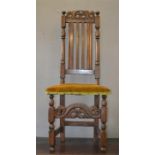 An 18th century hall chair with umber velvet seat.