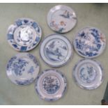 A group of seven chargers/plates, including Delft and Chinese, blue and white and one polychrome.