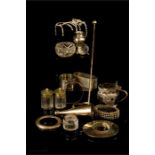 A group of silver and silver plated items to include napkin rings, Heals snuffer, bangles, salt