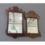 Two Georgian fret carved wall mirrors.