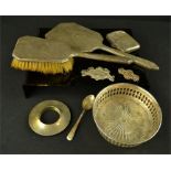 A group of silver brushes and mirrors, wine coaster, vesta case, spoon, brooch etc.