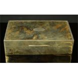 A silver and tortoiseshell box, inlaid with decoration to the lid.