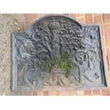 A large cast iron fire back, depicting tree of life, CR with crowns and leaves, 72 by 85cm wide.