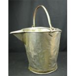 A metal milk pail, circa 1900, 35cm by 42cm.