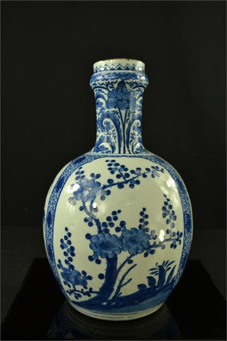 An early 19th century blue and white bottle vase, 26cm high.