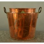 A large Victorian copper wine cooler.