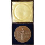 A bronze commemorative medallion, in original box.