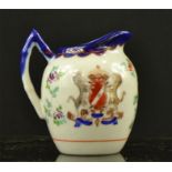 A small Chinese porcelain jug, bearing coats of arms.