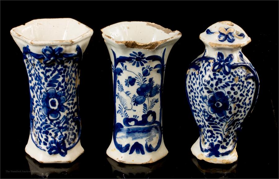 Three miniature early 18th century Delft blue and white vases and lidded jar.