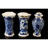 Three miniature early 18th century Delft blue and white vases and lidded jar.