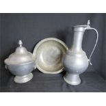 A pewter bowl marked IBS 1849 MTS, 32cm diameter, a Flemish ewer 41cm high, and a lidded bowl 31