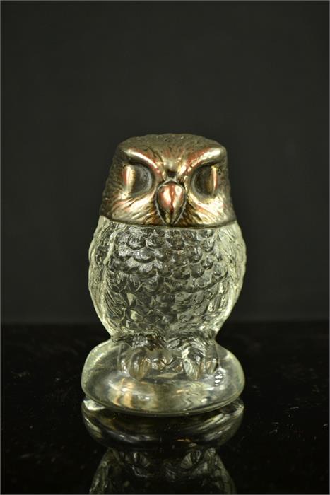 A pressed glass owl with silver plated head form top. 9½cm high.