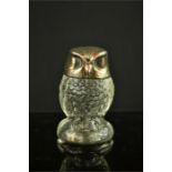 A pressed glass owl with silver plated head form top. 9½cm high.