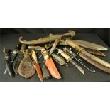 A group of hunting knives, daggers, leather powder flask etc.